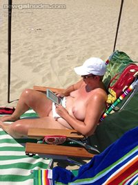 A little nude reading on the beach makes my juices flow. Sure good use a go...